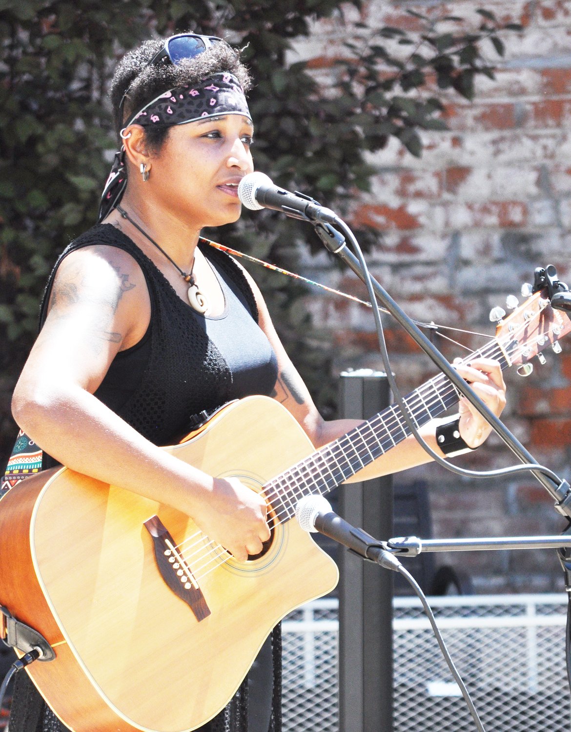 Claire "Sheeza" Tchoula performs during Lunch on the Plaza 2.0 at Marie Canine Plaza Friday.